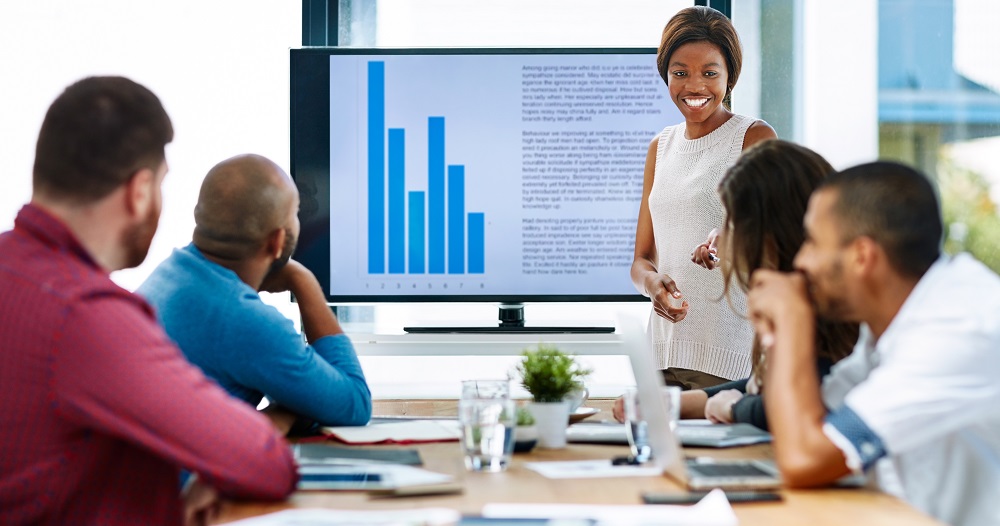 Cropped shot of a young female designer giving a presentation in the boardroom